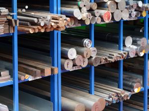 Rack filled with various shapes and sizes of steel bar.