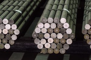 rolled cold round bars stacked in a hexagon shape banded together with wire ties