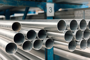 Stainless Steel Pipes organized on a blue shelf